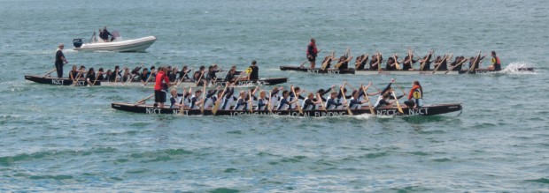 Dragon boat racing on the seafront.